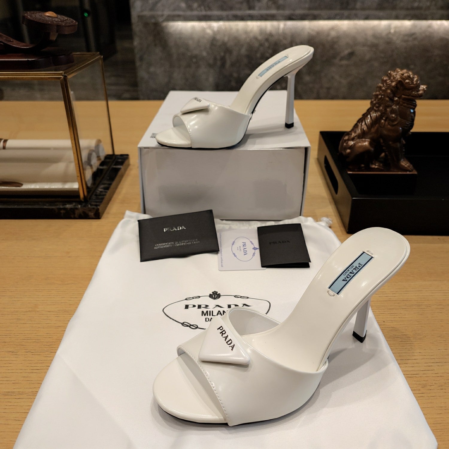 Prada 26S Open-Toe Mules 100mm in Ivory White Patent Calfskin with Logo