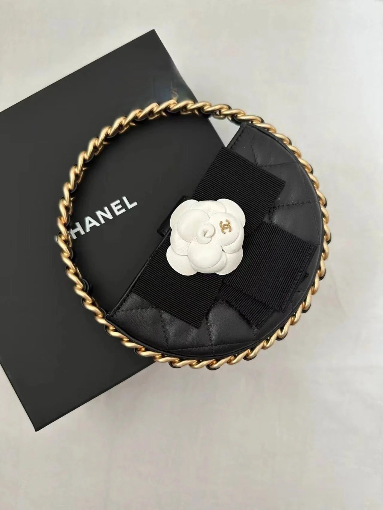Chanel 2026 Quilted Round Camellia Mini Clutch 16cm Lambskin
