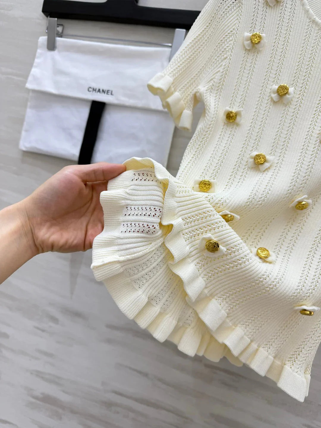 Chanel 2026 Gold Button Bow Short-sleeve Top Cream Cotton 394202