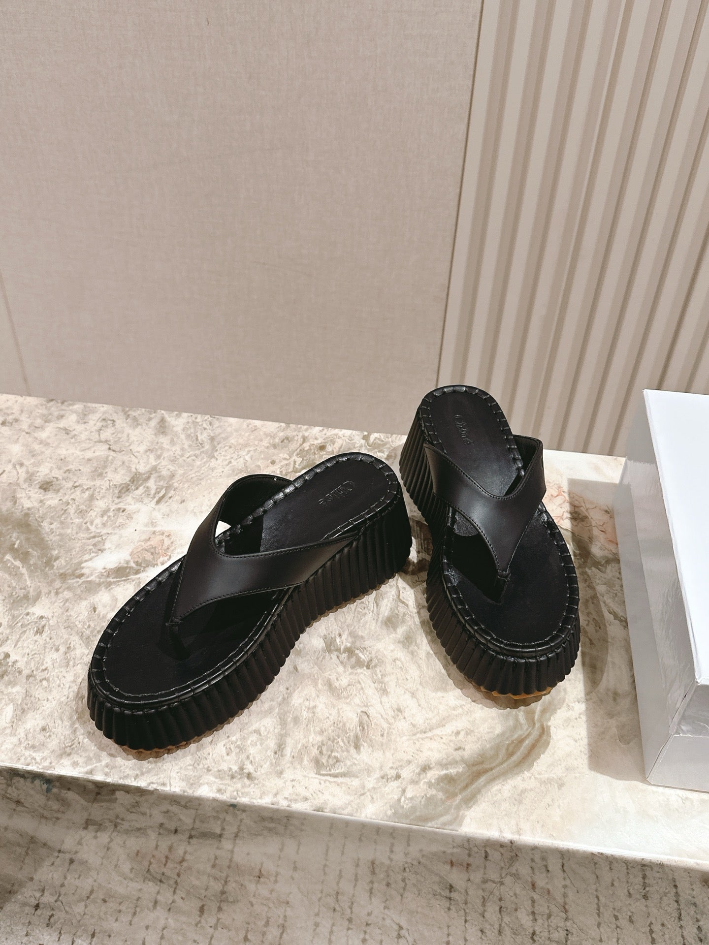 Chloé 26S Platform Flip-Flops in Black Lambskin.