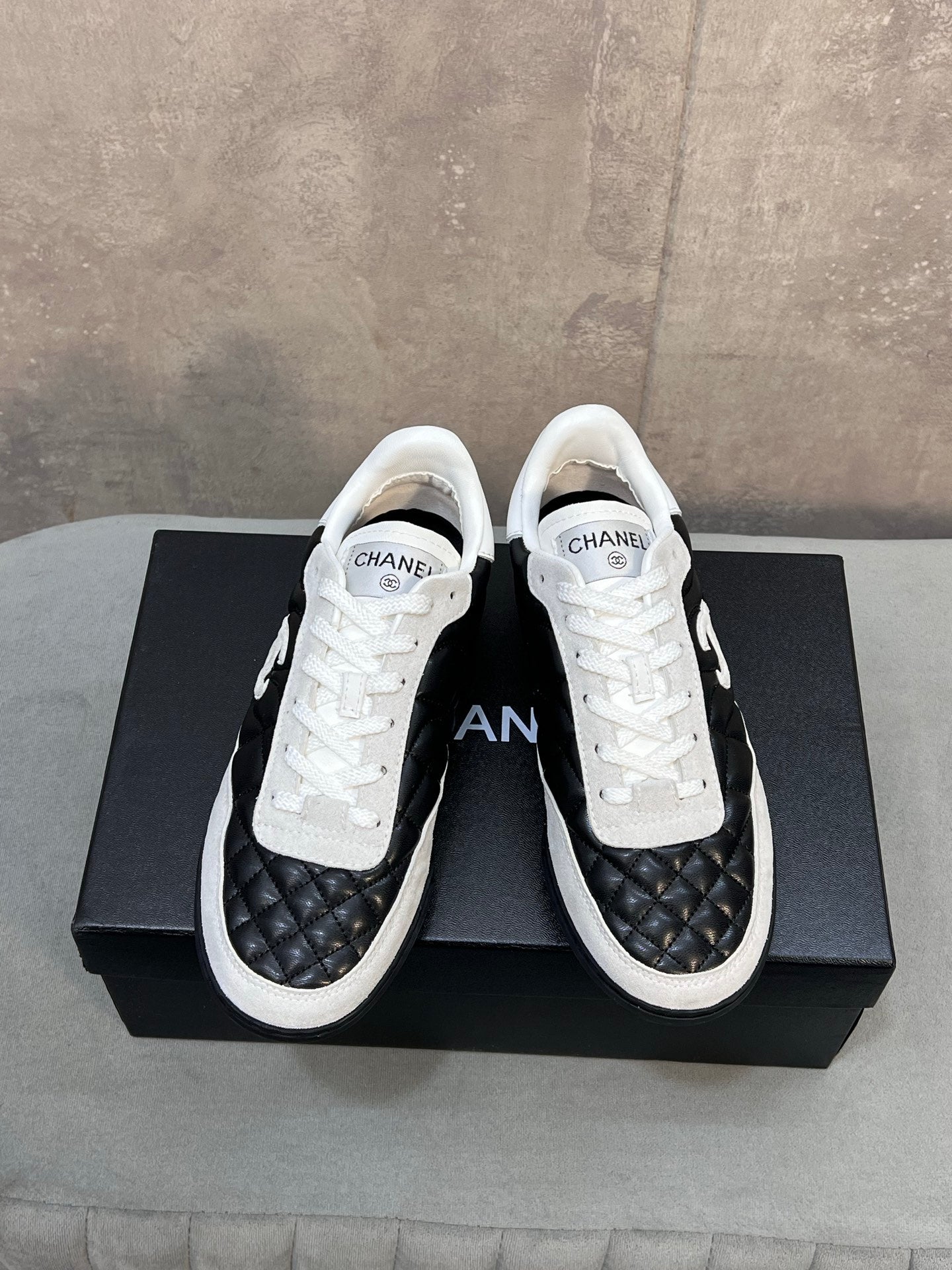 Chanel 26s Sneakers In Black And White Quilted Calfskin CC Logo