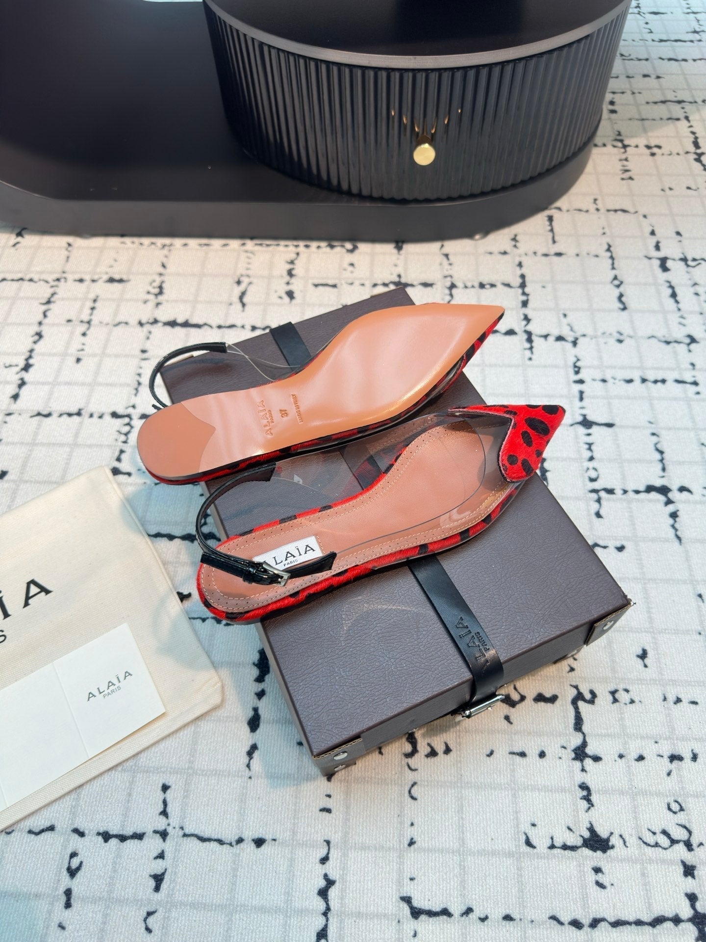 ALAIA FLAT SLINGBACK IN CHERRY RED HORSE HAIR AND FILM