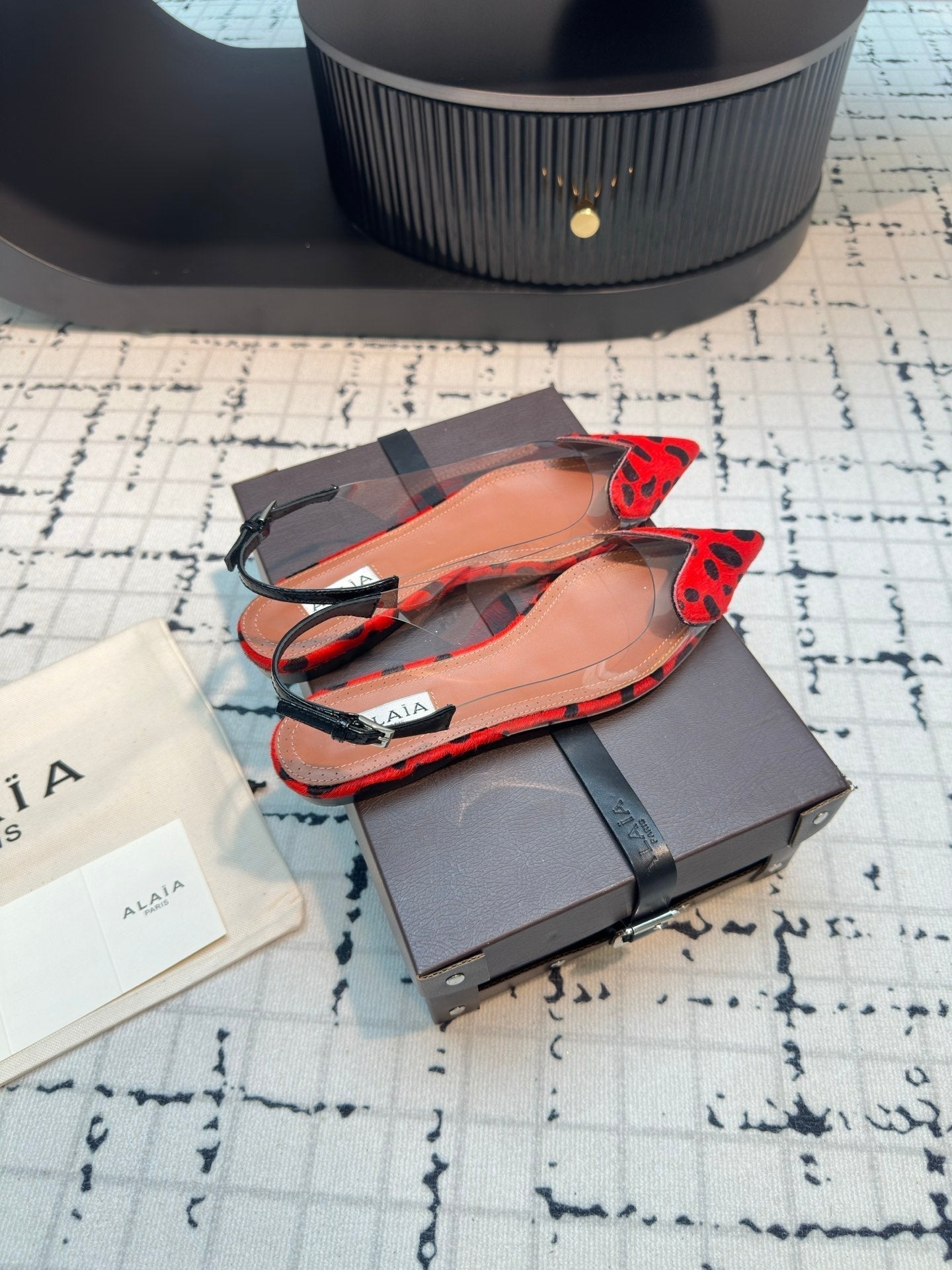 ALAIA FLAT SLINGBACK IN CHERRY RED HORSE HAIR AND FILM