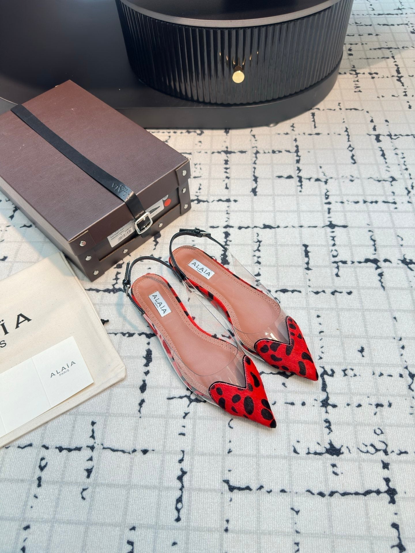 ALAIA FLAT SLINGBACK IN CHERRY RED HORSE HAIR AND FILM