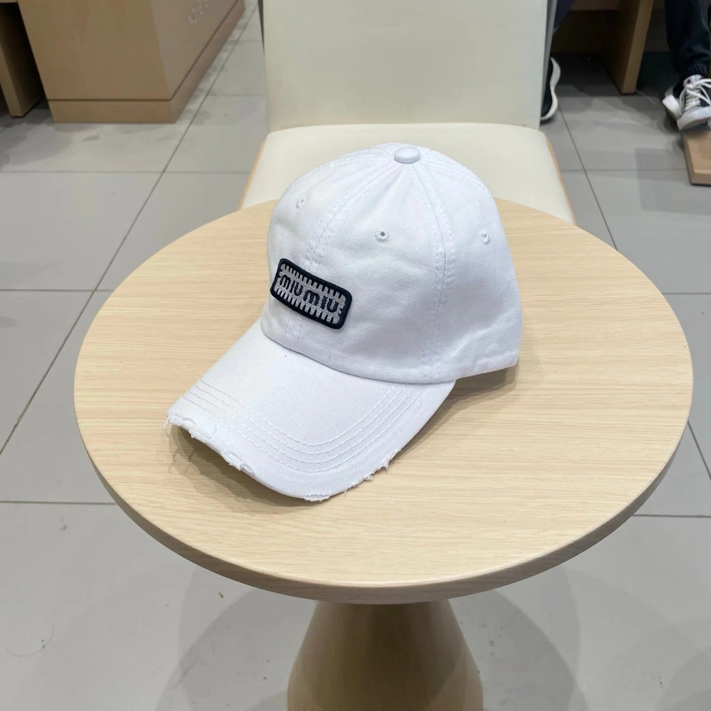 MM DISTRESSED FABRIC BASEBALL CAP IN WHITE WITH EMBROIDERED LOGO