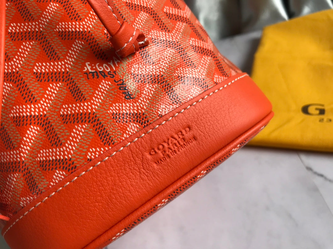 PETIT FLOT BUCKET BAG 22 IN ORANGE GOYARDINE CANVAS AND LAMBSKIN TRIM