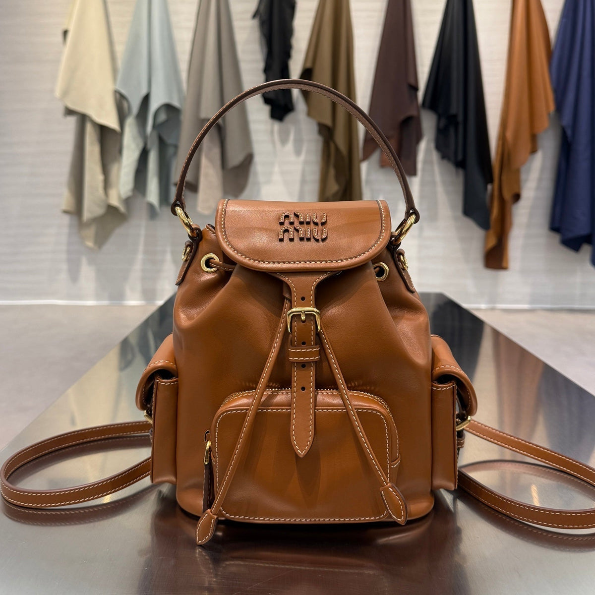 MiuMiu 2026 Buckle Gold Backpack Leather