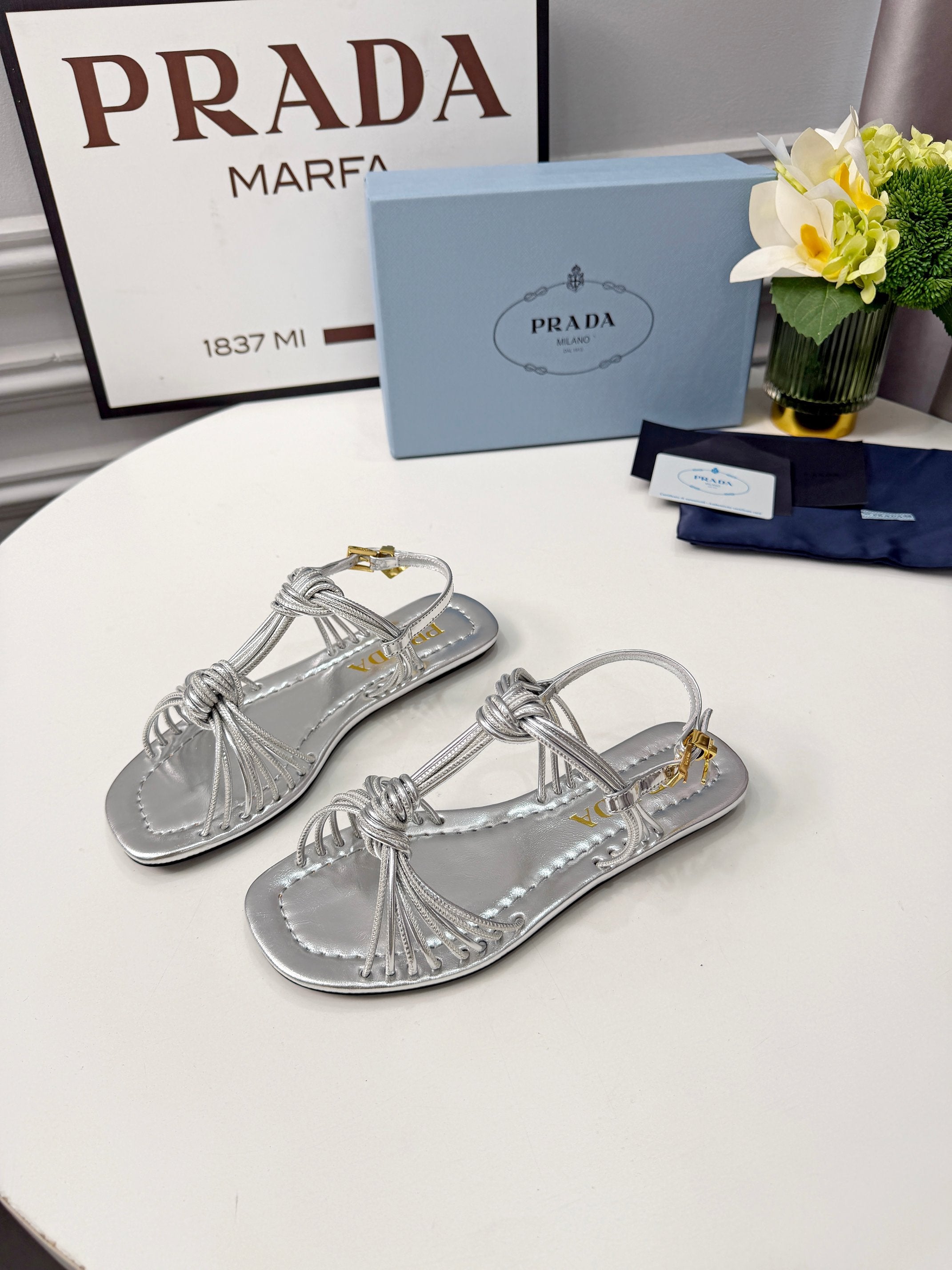 Prada 26s Knotted Metallic Leather Flat Sandals Sliver Metalic Leather 986577