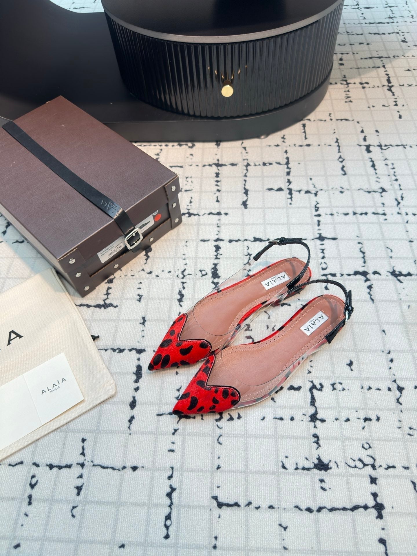 ALAIA FLAT SLINGBACK IN CHERRY RED HORSE HAIR AND FILM