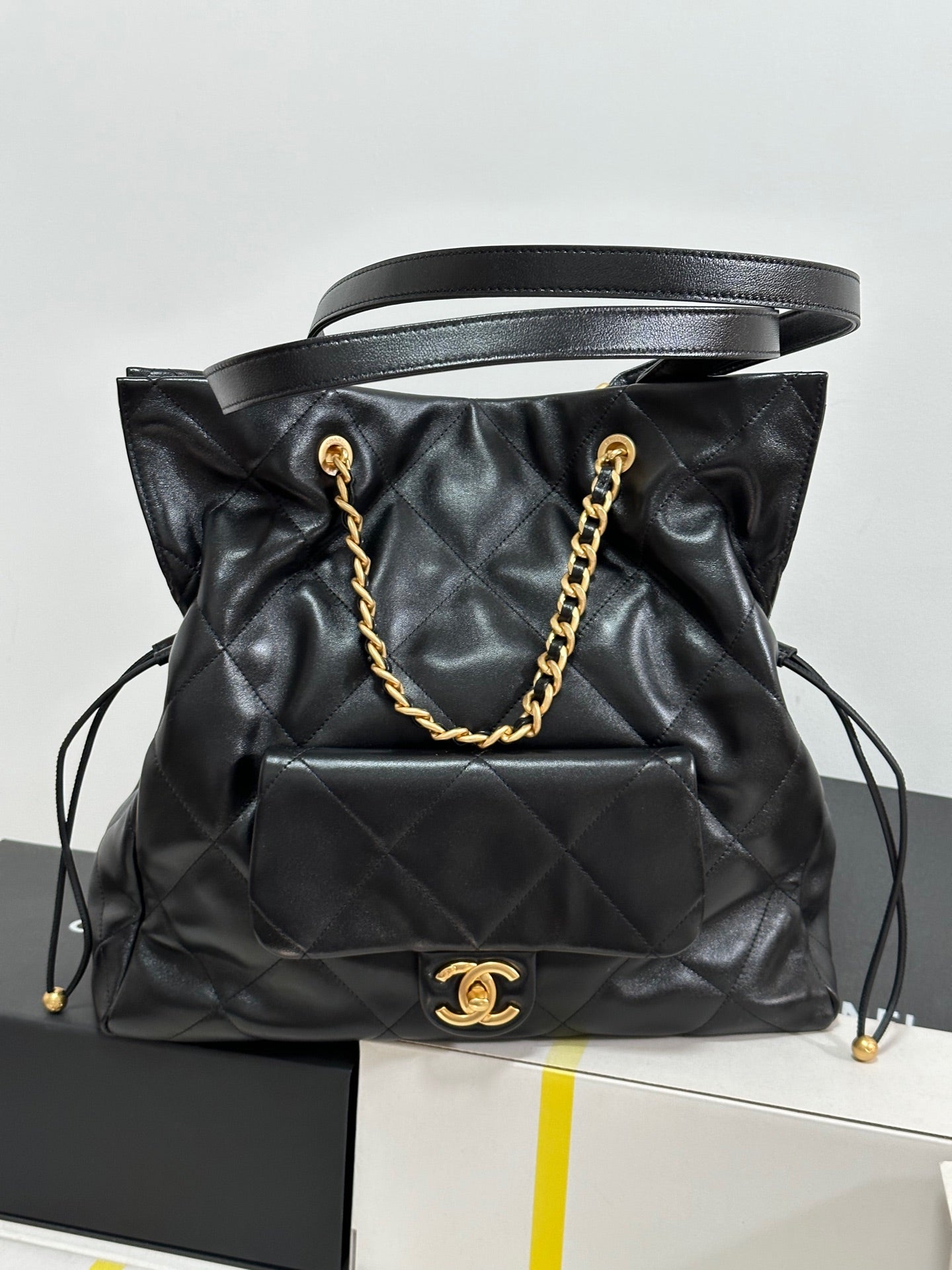 CC 25C Drawstring Backpack Black Lambskin Gold Hardware 243655