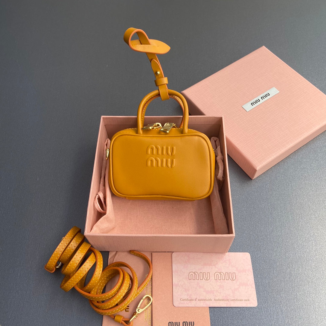 MICRO BAG KEYCHAIN 11  IN INDOCHINE ORANGE CALFSKIN EMBOSSED LOGO