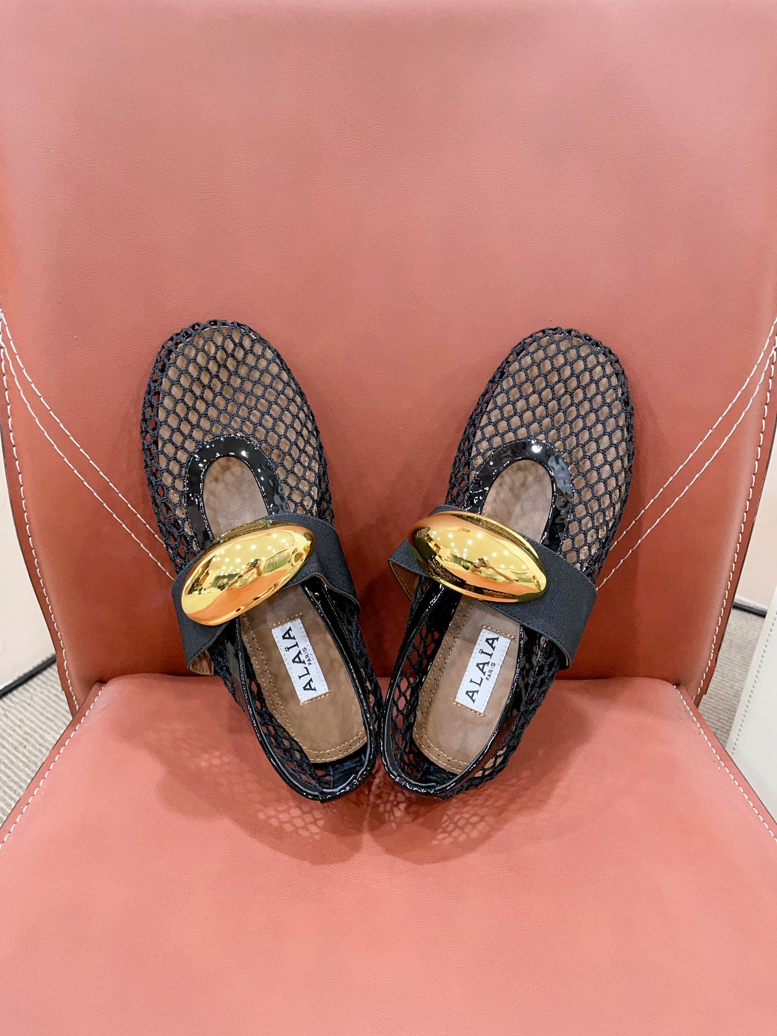 ALAIA MARY JANE SHOES IN BLACK MESH WITH GOLD HARDWARE