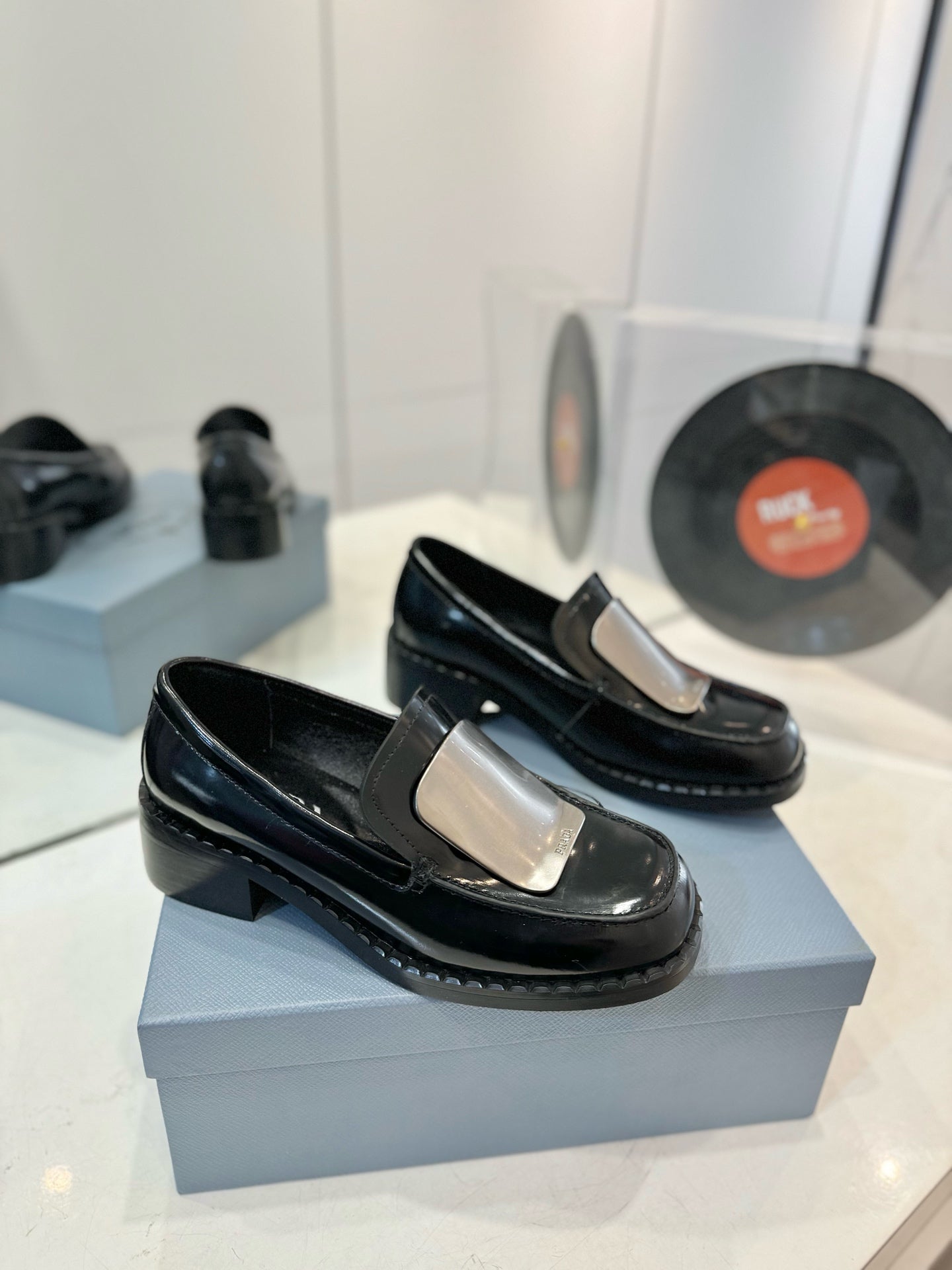 Prada 26s Metal Plate Loafers Black Brushed Leather 941513