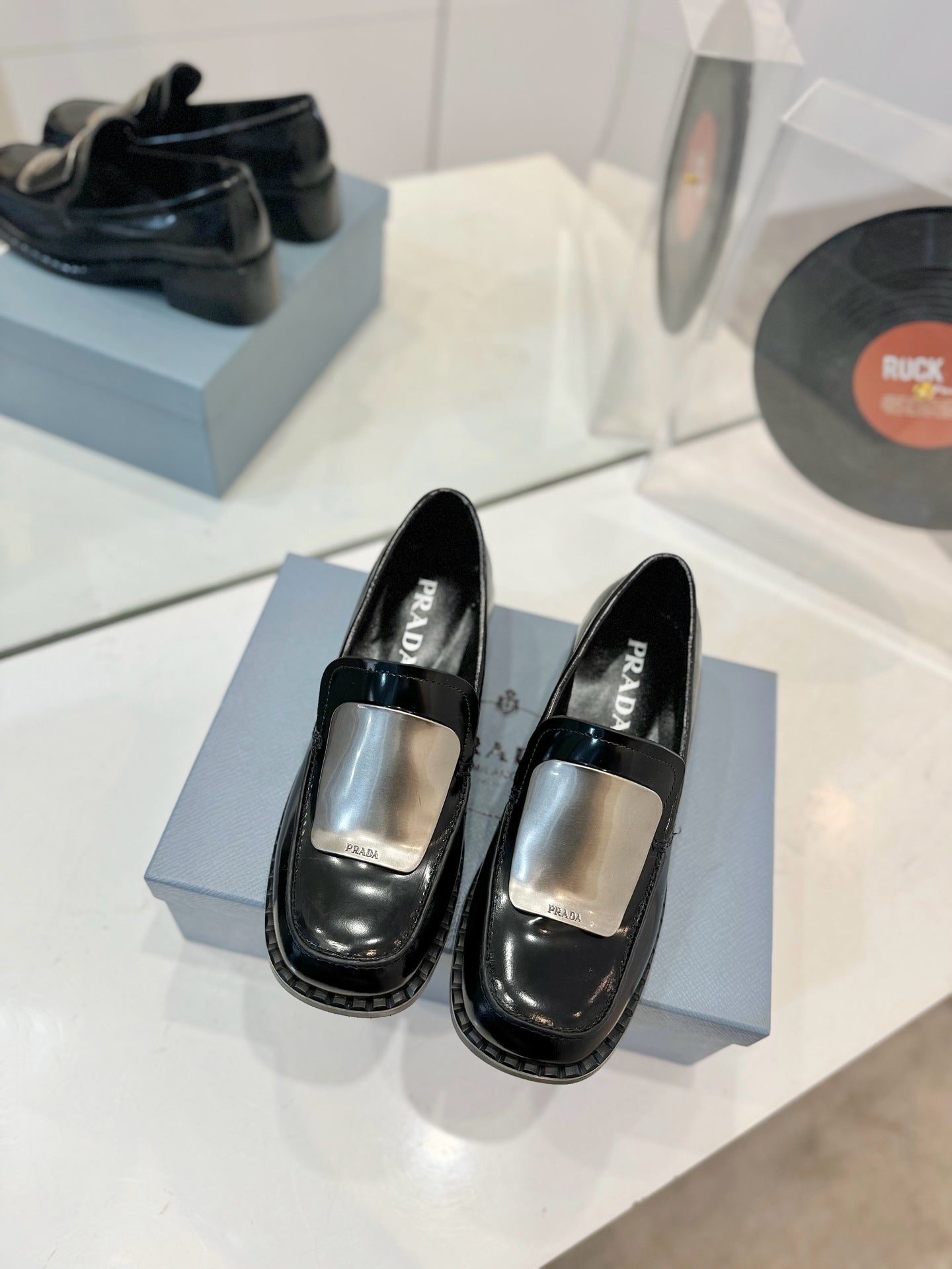 Prada 26s Metal Plate Loafers Black Brushed Leather 941513