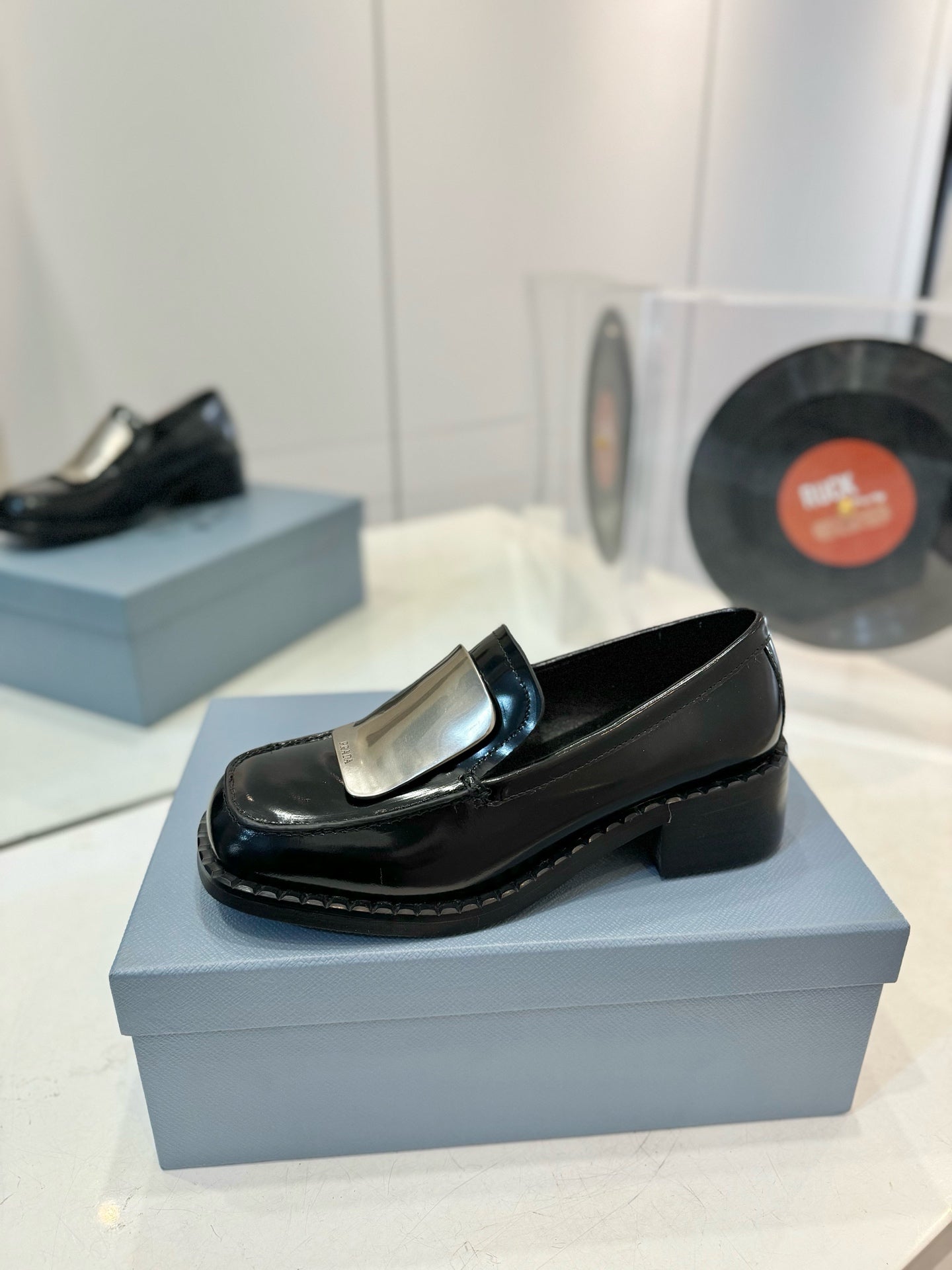 Prada 26s Metal Plate Loafers Black Brushed Leather 941513