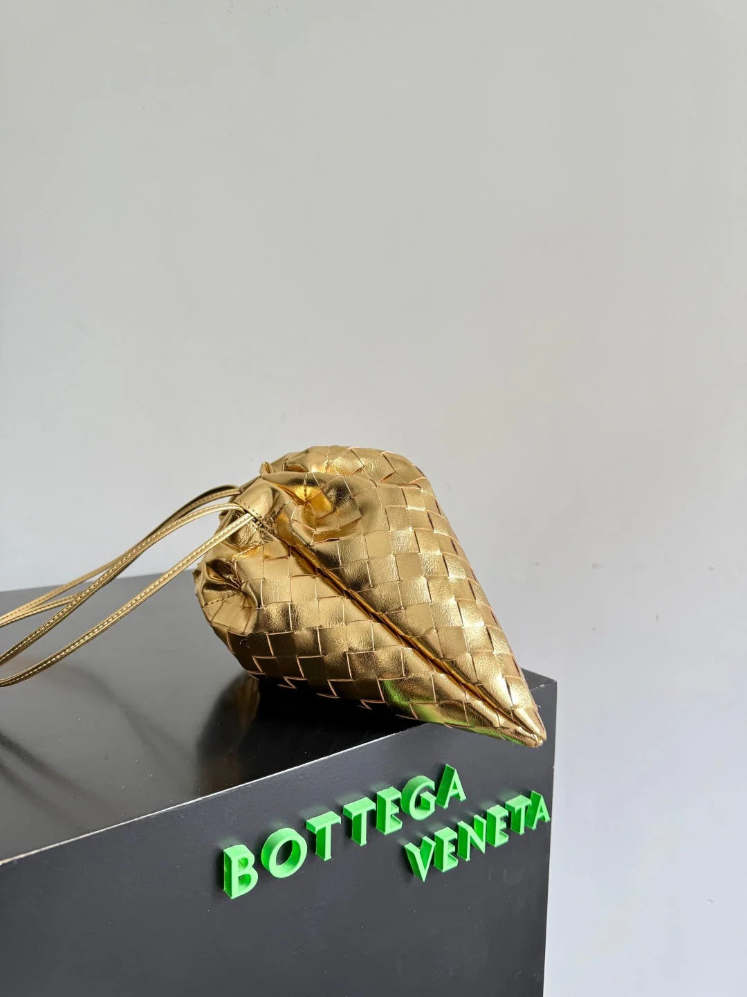 Bottega Veneta 2026 Dust Bag Gold Laminated Leather