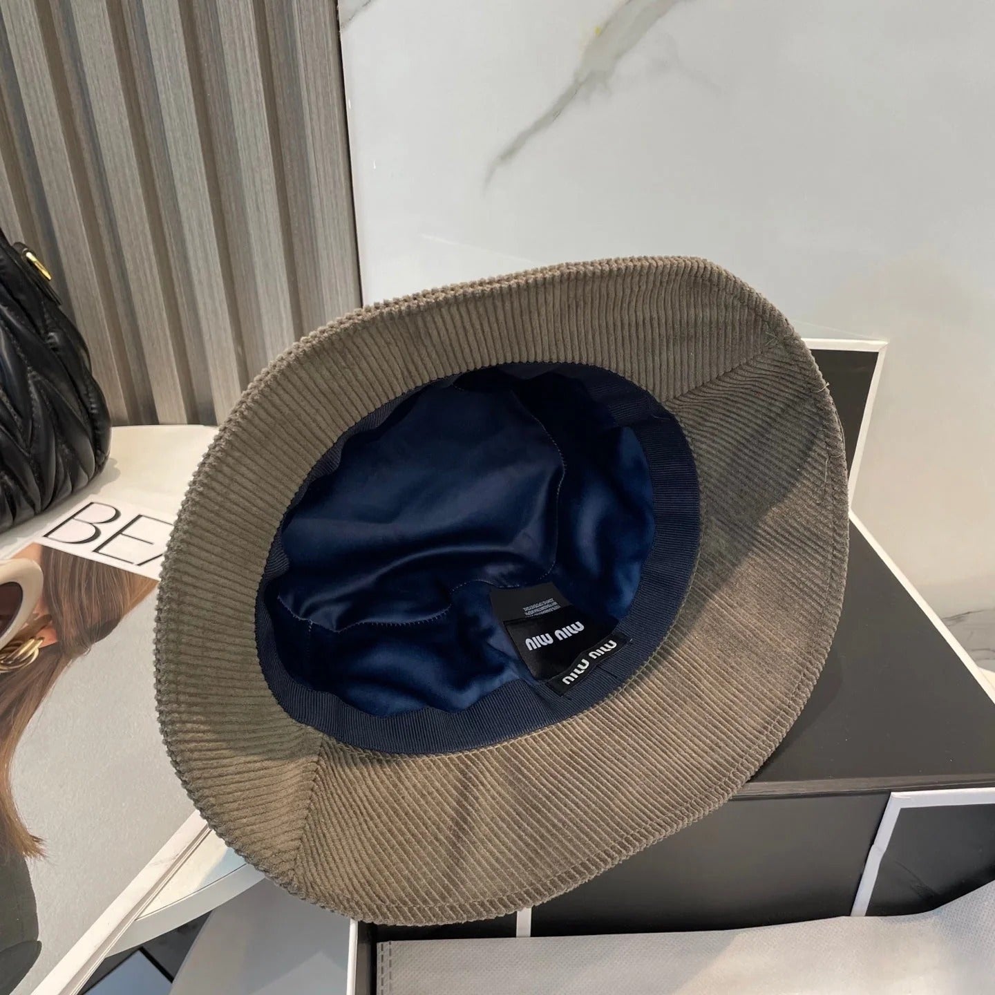 MM BUCKET IN MUTED BROWN VELVET WITH LOGO